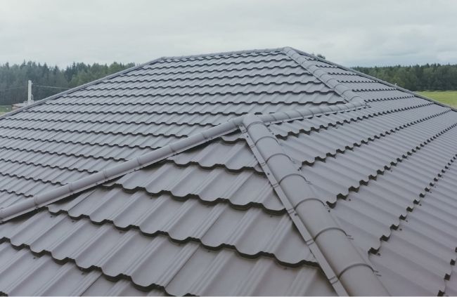 Newly restored tiled roof in Gold Coast with clean ridge capping and fresh protective coating for long-lasting weather resistance.